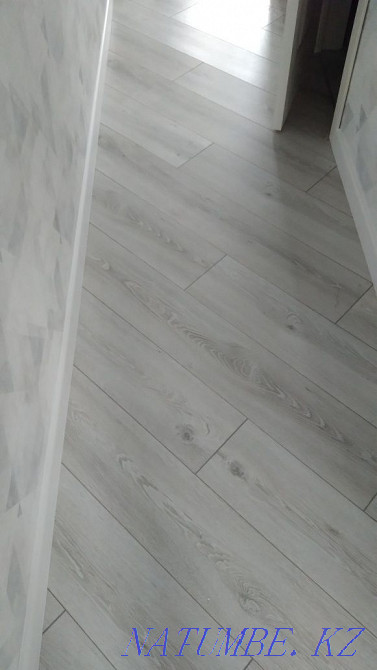 Laying laminate, pouring the floor, installing the plinth. Astana - photo 2
