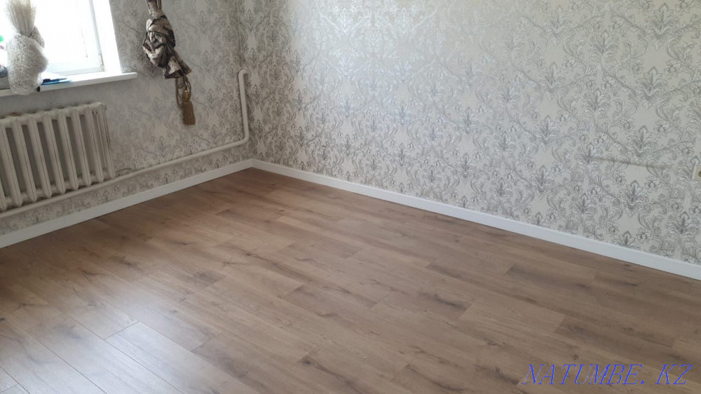Laying laminate, pouring the floor, installing the plinth. Astana - photo 1