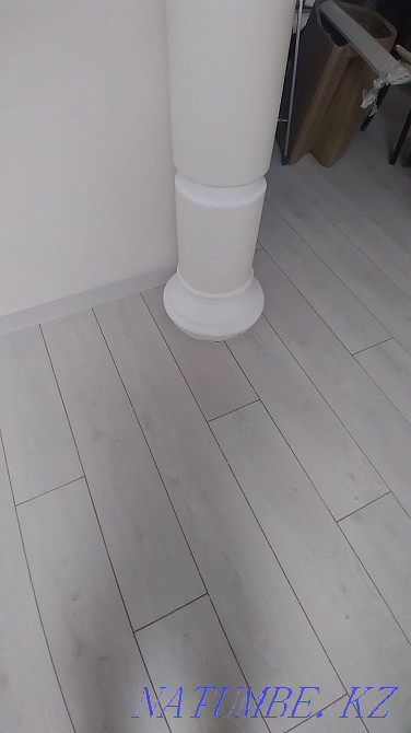 Laying laminate, pouring the floor, installing the plinth. Astana - photo 8