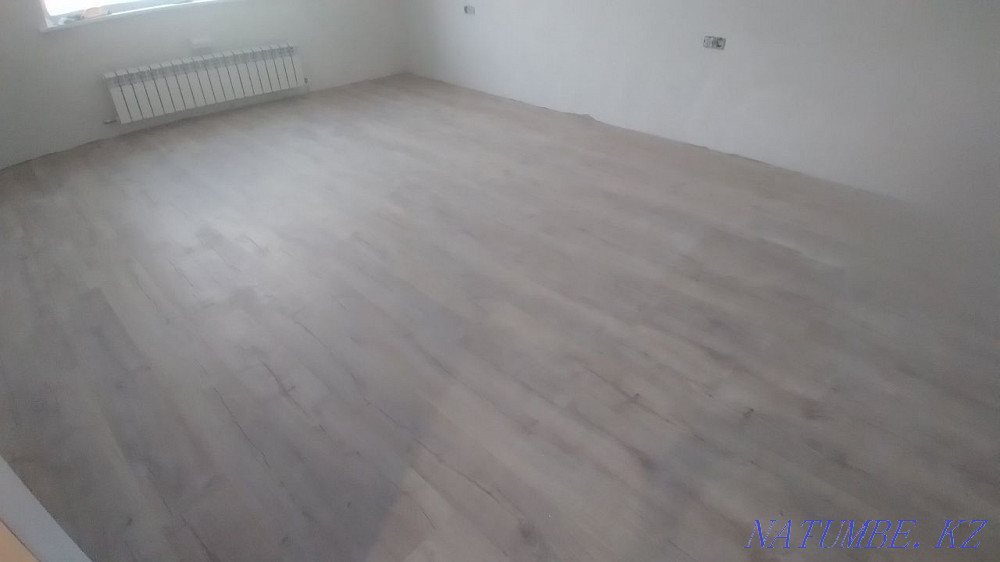 Laying laminate, pouring the floor, installing the plinth. Astana - photo 7