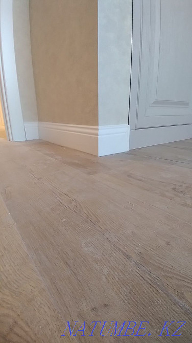 Laying laminate, pouring the floor, installing the plinth. Astana - photo 5