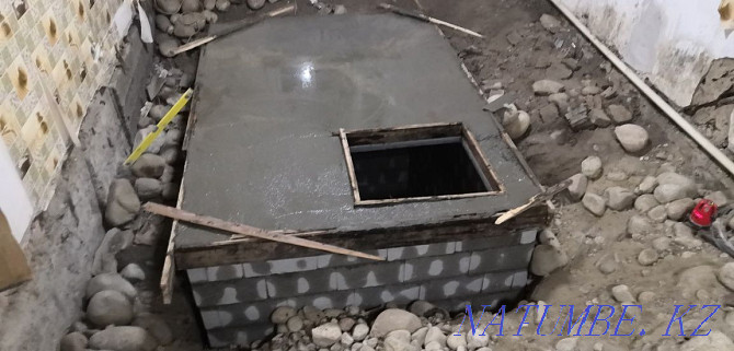 Digging a septic tank with trenches connecting to the central water supply. Sewerage Almaty - photo 1