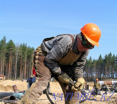 Gas welder cutting metal with a cutter, installing a heating boiler Almaty - photo 1