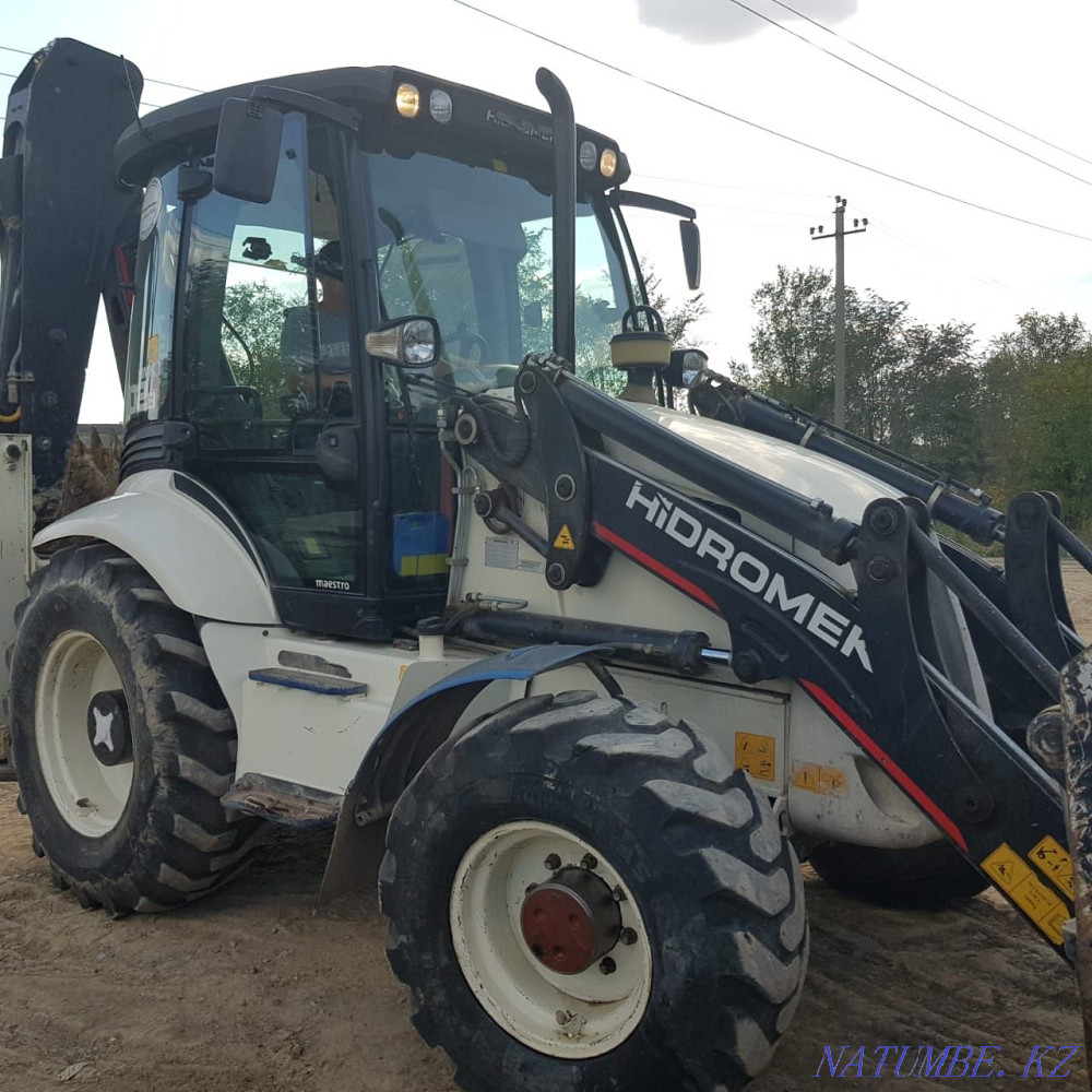 Services of a backhoe loader and a soil cutter (bar, milling cutter) Aqsay - photo 1