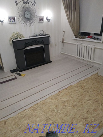 Laying laminate, linoleum, carpet, pouring self-leveling floor Almaty - photo 1