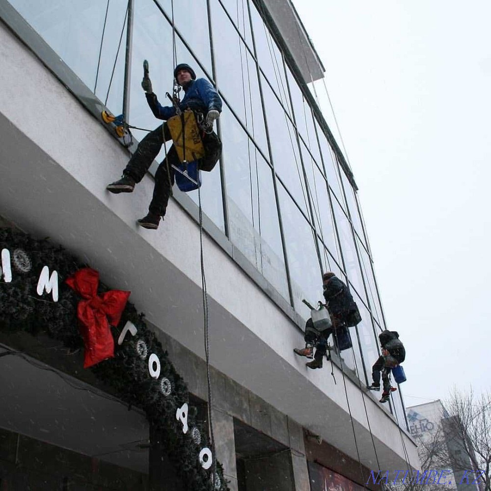 Climbers in Astana Facade works Industrial mountaineering Window washing Astana - photo 4