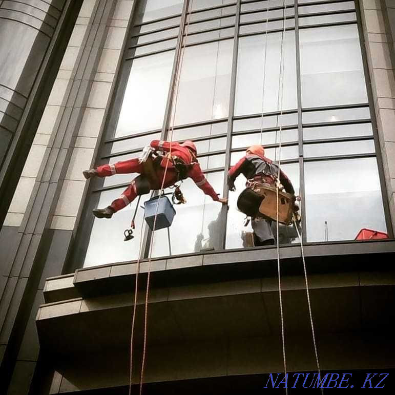 Climbers in Astana Facade works Industrial mountaineering Window washing Astana - photo 2