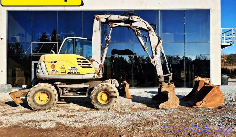 Колесный экскаватор MECALAC 714 МВт Астана - изображение 1