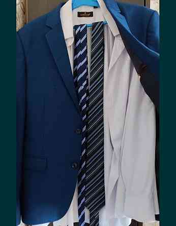 Продам мужской костюм, синего цвета, новый,46 размера,с рубашкой Тельмана