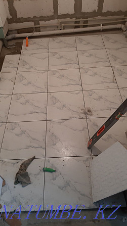 Laying tiles repair finishing Almaty - photo 1