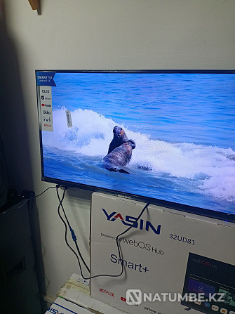 Smart TV; екі қашықтан басқару құралы қосылған. Үшарал - изображение 4