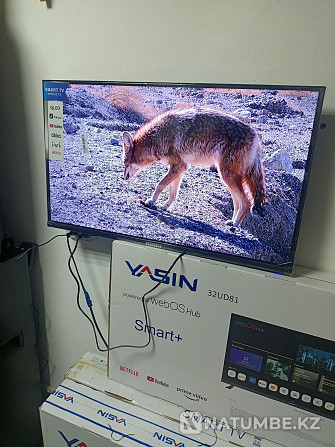 Smart TV; екі қашықтан басқару құралы қосылған. Үшарал - изображение 3