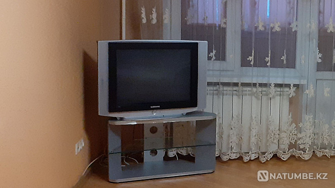 Selling a used TV with stand Almaty - photo 1